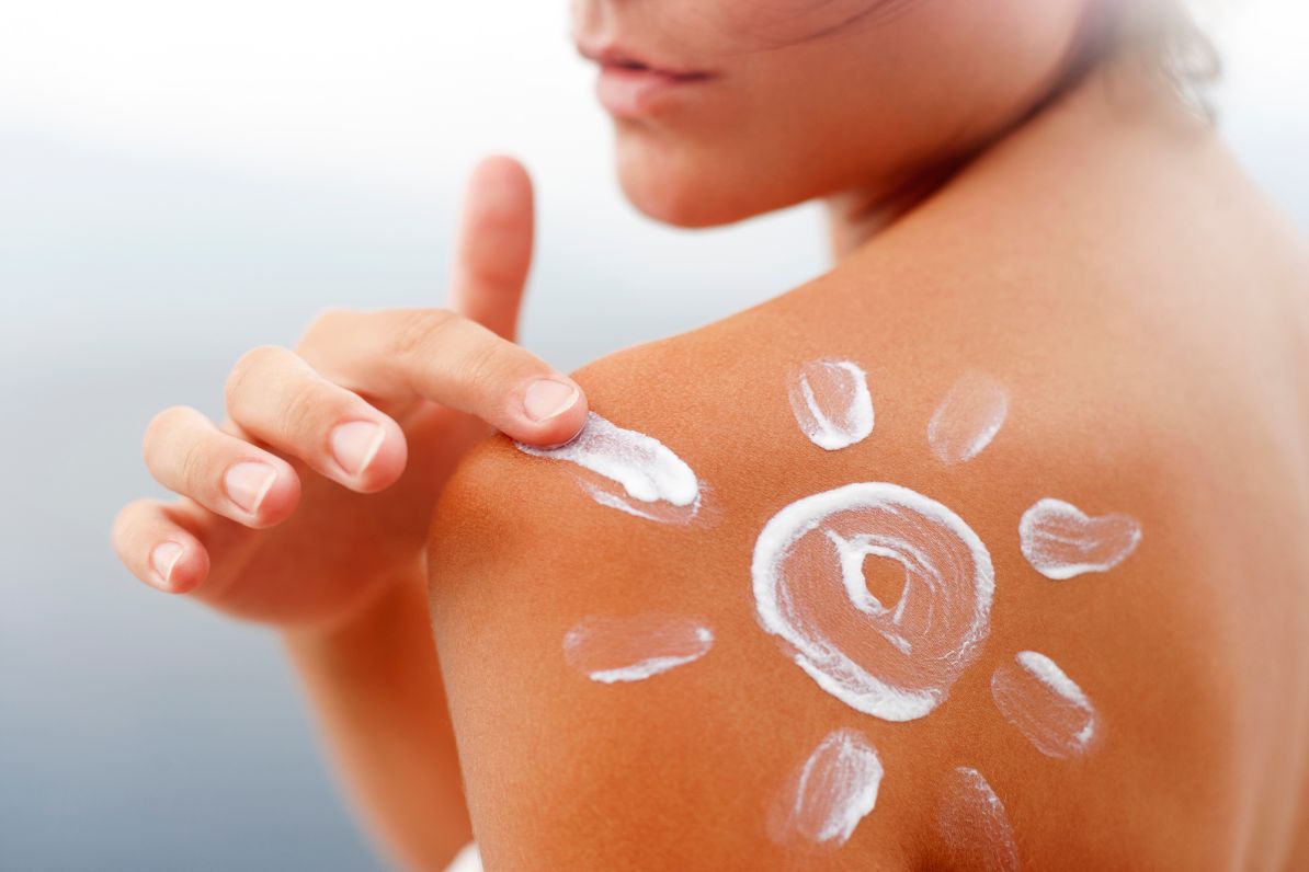 woman with SPF cream on her back